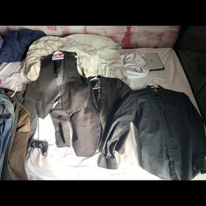 Suite jacket, black collared shirt, vest